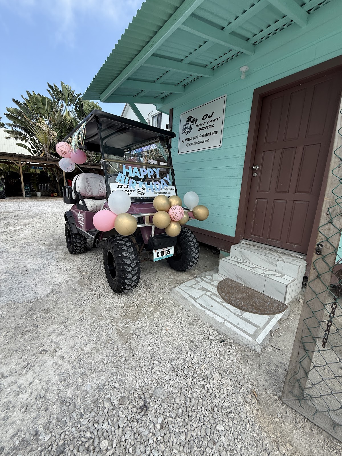 Red golf cart with birthday decorations